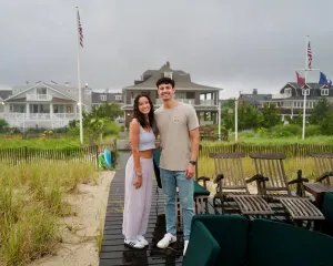Dr. Cornejo's children Christian and Grace standing on a dock smiling